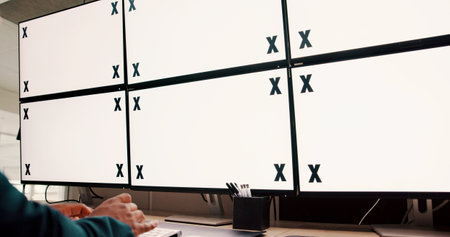 Computer screens, office and hands typing by space for security, safety or cctv footage on monitor. Protection service, tracking markers and person by blank desktop with surveillance in control room.の写真素材
