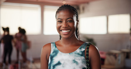 Portrait, smile and woman in gym, fitness and confidence with exercise goals, pride and workout. African person, runner and athlete in wellness center, happiness and training with health benefitsの写真素材