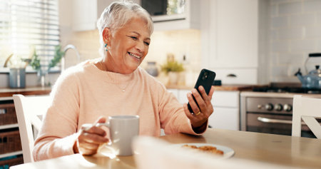 Cellphone, video call and senior woman in kitchen with communication, networking or contact. Coffee,...