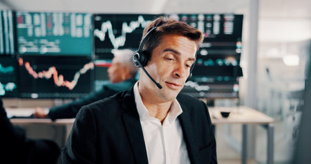 Man, headset and talking with computer of trading plan, stock market increase and review financial growth. Trader, discussion and help with problem solving advice, value update and monitor investmentの写真素材