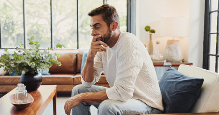 Thinking, crisis and man in home with stress for bankruptcy, financial challenge or difficult...