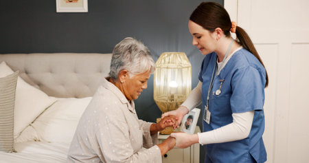 Nurse, senior woman and holding hands for support, helping and healthcare for retirement. Patient,...