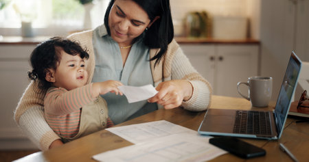 Mom, baby and documents with remote work from home, freelancing and laptop with care, bonding and play. Woman, virtual assistant and mother with infant, child and love by computer in family houseの写真素材