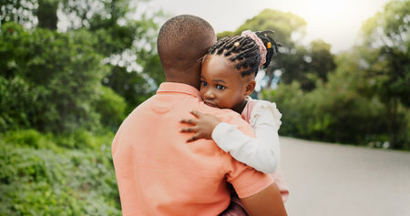 African father, child and hug outdoor for love, care and bonding together with family for...