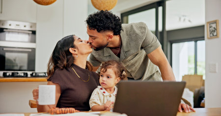 Remote work from home, baby and couple with kiss, laptop and romance with start to day. Kid, mother and father with kid, relationship and morning with affection, family or coffee with love or parentsの写真素材
