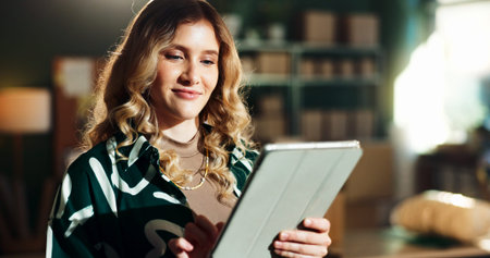 Delivery, small business and woman typing on tablet for inventory management, package export or...