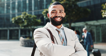 Travel, portrait or businessman in city with arms crossed, confidence or finance opportunity in urban town. Smile, financial advisor or proud consultant in street for career, commute or appointmentの写真素材
