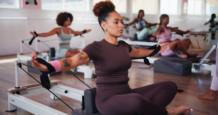 Exercise, pilates and reformer with woman in class for improvement, training or workout routine....