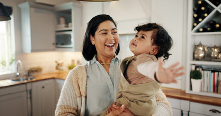 Home, hug and mom laughing with baby, smile and care for bonding together with love, parent or...