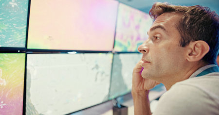 Screen, weather and man on computer for forecast, news research or ecology with fatigue. Tired, check or tracking technology equipment with maps for meteorology report, storm radar or climate changeの写真素材