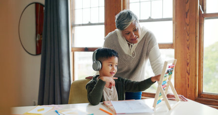 Abacus, senior woman and child with headphones, tutor or listening to audio for math or education. Counting, student and kid with tech for homework, growth and development with grandma or calculationの写真素材