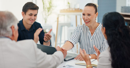 Success, handshake and teamwork with business people in meeting for support, celebration and deal...