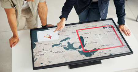 Engineer, people and hands with map on screen for turbine location, power development and renewable...