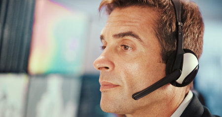 Emergency, service and man with headset for security, dispatcher and operator on computer....