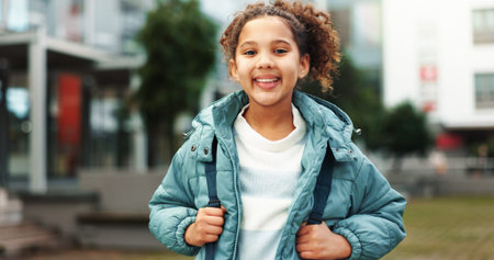 Happy, city and portrait of child at school outdoors ready for class, lesson and learning with...