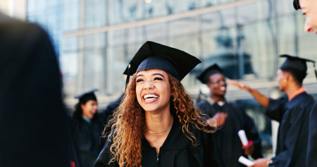 Graduation, happy woman or student thinking at university for school education, opportunity or success. Ideas, scholarship or confident graduate at campus with dream, smile and college achievementの写真素材