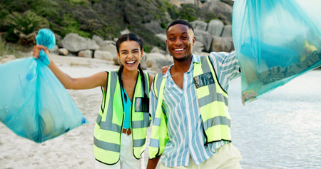 Happy people, portrait and volunteer with dirt on beach for community service or cleaning in nature....