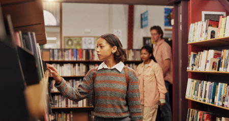Girl, student and shelf with books in library for choice, textbook search and studying for exam....