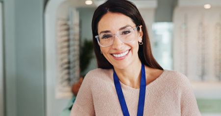 Optometrist, eye care or woman in optometry store for frame assistance, vision correction or help with contact lenses. Retail shop, mature person or happy for service, visual prescription or portraitの写真素材