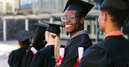 Graduate, ceremony or portrait of happy man at university for education goal, school or success....
