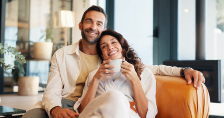 Home, relax and couple with coffee, portrait and bonding together in living room. Smile, apartment...