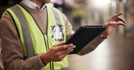 Hands, tablet and distribution at warehouse, logistics or check schedule for export delivery. Person, engineer and digital touchscreen on application for freight, storage or point at industrial plantの写真素材