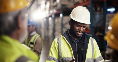 Logistics, colleagues and discussion with tablet, warehouse and quality assurance on website and group. Factory, collaboration and team with tech for supply chain, conversation and business peopleの写真素材