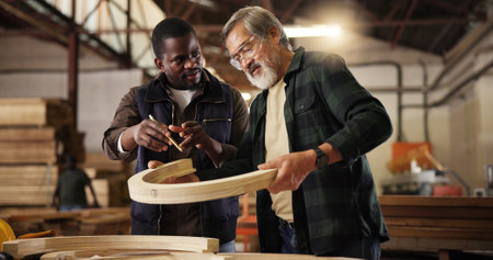 Furniture, teamwork and carpenter with people in factory for design production, woodwork and manufacturing. Collaboration, supervisor and framework with men for building project and constructionの写真素材