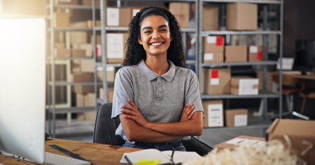 Portrait, ecommerce and woman with arms crossed, boxes and smile with confidence, supply chain and warehouse. Happy, person and employee with pride, distribution center and delivery with logisticsの写真素材