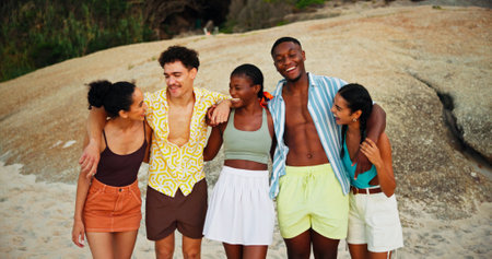 Smile, group and friends with hug on beach for travel reunion, social gathering and summer holiday. People, laugh and funny joke with embrace for vacation trip, tropical island and bonding on getawayの写真素材