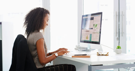 Business, internet and woman in workplace, computer and research for climate change. Person, typing...