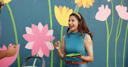 Woman, laugh and painting for wall art, mural process and decoration design of community project....