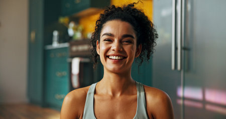 Portrait, woman and fitness at home for health, happiness and positive mood with exercise. Laugh, cheerful and female person with a smile for workout, wellness and stress relief in house or apartmentの写真素材