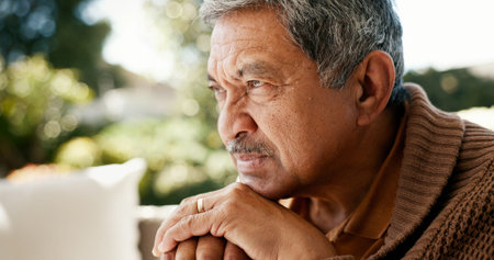Thinking, sad and elderly man at house of memory grief, nostalgia and past reflection. Relaxing,...