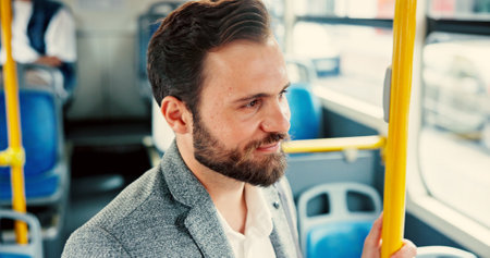 Bus, travel and business man by rail in city for journey, morning commute and trip to office. Public transport, passenger service and person thinking on vehicle to work, job and career in urban townの写真素材