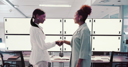 Handshake, people or space on computer in finance for trading, merger or partnership in night. Teamwork, tracking markers or women traders with mockup on monitor for hiring agreement in data centerの写真素材