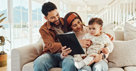 Parents, baby and tablet on sofa, happy and care with video, cartoon and streaming in living room at...