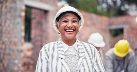 Construction, happy and portrait of mature woman in city for inspection, building and maintenance. Civil engineering, architecture and person with hard hat for project, infrastructure and planningの写真素材