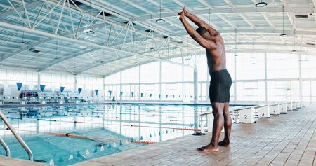 Athlete, black man and warm up of swimming sports, fitness event and training preparation. Male person, stretching muscle and exercise practice, workout competition and performance of cardio progressの写真素材