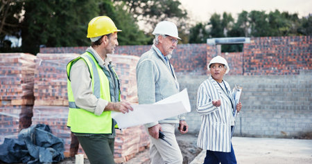 Business people, engineer or walking with blueprint at site for construction planning or...