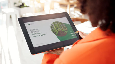 Person, tablet and presentation for climate change in office, information and solution for environment. Screen, woman or digital with proposal catalog, eco friendly tips or report for ecology projectの写真素材