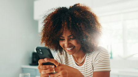 Online dating, reading or happy woman with mobile in home on social media application or subscription. Smartphone, smile or person with flirty message for post, chat and romantic search on websiteの写真素材