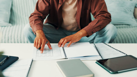 Budget, home or hands of man with notes, diary or finance statement for household bills or mortgage....