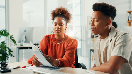 Paperwork, coaching and team of business people in office for planning or news idea in creative startup. Document, internship and training with mentor for project report, journalism and strategyの写真素材