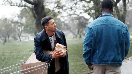 Homeless man, shopping cart and begging for food with brown paper bag, donation and support in winter. People, giving and meal package for help, kindness or empathy for charity, poor and care at parkの写真素材