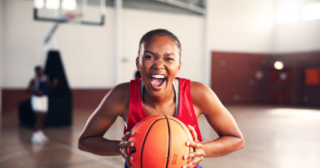 Portrait, shout and woman with basketball for sports, workout challenge or competition. African player, scream or person with ball at court for fitness, energy or determined athlete with motivationの写真素材