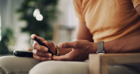 House, hands and man with diabetes machine, testing for glucose levels and chronic disease. Closeup, apartment and person in living room, medical and sugar with insulin, monitor and hypertensionの写真素材