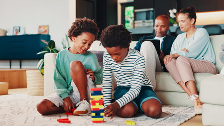 Building blocks, playing and kids on floor in home for development, growth or bonding. Happy, toys and boy children on carpet in living room for connection, friendship or siblings together in house.の写真素材