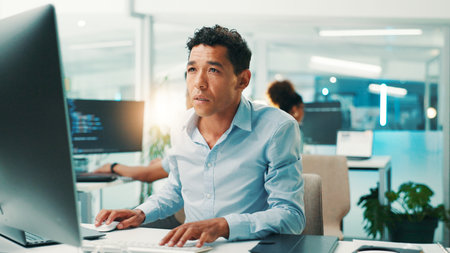 Programmer, man and reading computer in office for software development, typing code or app testing....