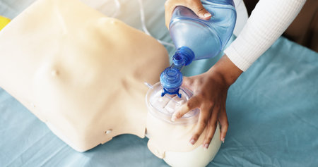 Training, oxygen and woman with mask, dummy and lesson to help in emergency, healthcare and...